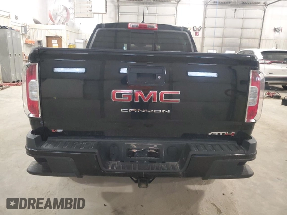 2021 GMC Canyon 4WD AT4 w/Cloth with VIN 1GTG6FEN2M1265863, listed as a Copart auction lot 49900865 with 50,102 mi miles and Salvage Title. Bid and sale history available at carsss.com. Image 6.