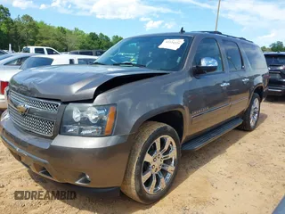 2011 Chevrolet Suburban LTZ with VIN 1GNSKKE3XBR394436, listed as a IAAI auction lot 42324225 with 132,871 mi miles and . Bid and sale history available at DreamBid. Image 17.