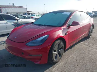 2021 Tesla Model 3 Long Range with VIN 5YJ3E1EB1MF071634, listed as a IAAI auction lot 41964321 with 39,596 mi miles. Bid and sale history available at carsss.com. Image 2.