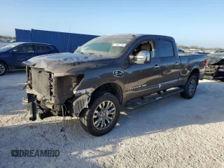 2016 Nissan Titan XD Platinum Reserve with VIN 1N6BA1F25GN506566, listed as a Copart auction lot 74627704 with 87,012 mi miles and Salvage Title. Bid and sale history available at carsss.com. Image 1.