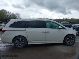 2015 Honda Odyssey Touring Elite with VIN 5FNRL5H98FB076428, listed as a IAAI auction lot 41998339 with 114,573 mi miles. Bid and sale history available at carsss.com. Image 13.