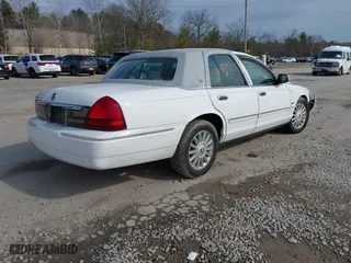 2010 Mercury Grand Marquis LS with VIN 2MEBM7FV7AX611959, listed as a IAAI auction lot 41980176 with 112,885 mi miles. Bid and sale history available at carsss.com. Image 4.