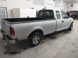 2002 Ford F-150 XL with VIN 1FTRX17W52NB23883, listed as a IAAI auction lot 41721680 with 144,115 mi miles. Bid and sale history available at carsss.com. Image 4.