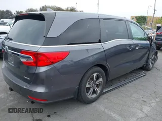 2018 Honda Odyssey Touring with VIN 5FNRL6H88JB062213, listed as a IAAI auction lot 42489379 with 90,578 mi miles and . Bid and sale history available at DreamBid. Image 4.