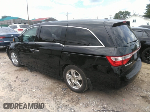 2012 Honda Odyssey Touring with VIN 5FNRL5H97CB066596, listed as a IAAI auction lot 42472935 with 217,182 mi miles and . Bid and sale history available at DreamBid. Image 3.