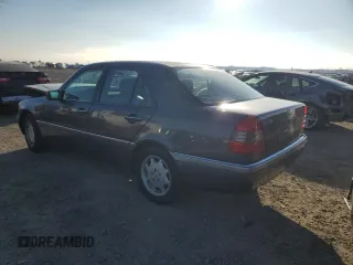 1997 Mercedes-Benz C with VIN WDBHA23E7VF545229, listed as a Copart auction lot 43518335 with 153,158 mi miles and Salvage title. Bid and sale history available at DreamBid. Image 2.