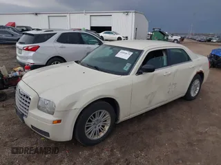 2009 Chrysler 300 LX with VIN 2C3KA43D09H508381, listed as a IAAI auction lot 41834673 with 112,152 mi miles. Bid and sale history available at carsss.com. Image 2.