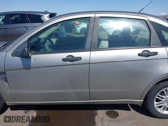 2008 Ford Focus SE with VIN 1FAHP35N68W154490, listed as a IAAI auction lot 42128643 with 141,316 mi miles. Bid and sale history available at carsss.com. Image 14.
