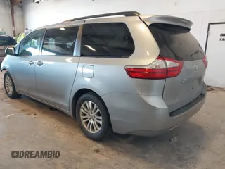 2015 Toyota Sienna XLE with VIN 5TDYK3DCXFS534633, listed as a IAAI auction lot 42018593 with 128,421 mi miles. Bid and sale history available at carsss.com. Image 3.
