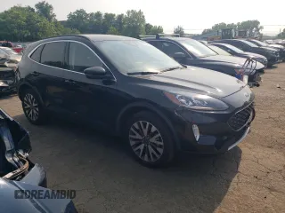 2020 Ford Escape Titanium z VIN 1FMCU9J97LUB25055, wystawiony jako Copart lot #60326945 z przebiegiem 78 711 mil mil oraz Szkoda całkowita • Salvage title. Historia ofert i sprzedaży dostępna na DreamBid. Obrazek 4.