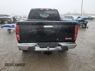 2011 GMC Canyon SLE1 with VIN 1GTH6MFE6B8141218, listed as a Copart auction lot 81897704 with 233,039 mi miles and Salvage Title. Bid and sale history available at carsss.com. Image 6.
