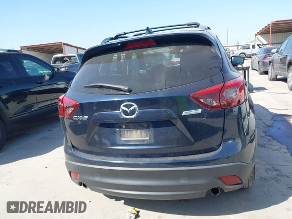 2016 Mazda CX-5 Grand Touring z VIN JM3KE2DY3G0797321, wystawiony jako IAAI lot #42017174 z przebiegiem 65 505 mil mil oraz . Historia ofert i sprzedaży dostępna na DreamBid. Obrazek 16.