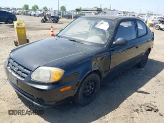 2003 Hyundai Accent with VIN KMHCF35CX3U271513, listed as a IAAI auction lot 42083235 with 166,240 mi miles. Bid and sale history available at carsss.com. Image 2.