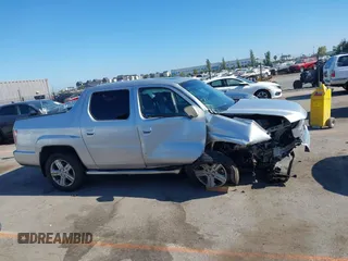 2012 Honda Ridgeline RTL with VIN 5FPYK1F56CB457687, listed as a IAAI auction lot 42582331 with 96,357 mi miles and . Bid and sale history available at DreamBid. Image 13.