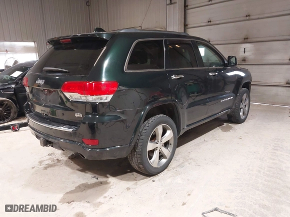 2014 Jeep Grand Cherokee Overland with VIN 1C4RJFCGXEC162109, listed as a IAAI auction lot 41943979 with 147,788 mi miles. Bid and sale history available at carsss.com. Image 4.