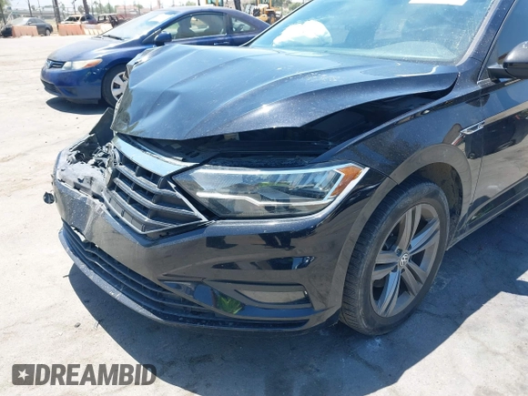 2019 Volkswagen Jetta S z VIN 3VWC57BU1KM116991, wystawiony jako IAAI lot #42377777 z przebiegiem 70 910 mil mil oraz . Historia ofert i sprzedaży dostępna na DreamBid. Obrazek 17.