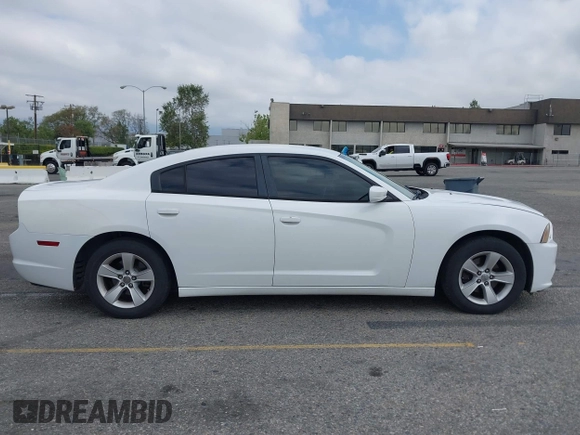2014 Dodge Charger SE with VIN 2C3CDXBG3EH131242, listed as a IAAI auction lot 42121260 with 231,452 mi miles and . Bid and sale history available at DreamBid. Image 13.