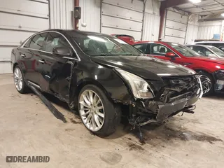2014 Cadillac XTS Platinum with VIN 2G61W5S88E9186969, listed as a IAAI auction lot 41422872 with 184,998 mi miles. Bid and sale history available at carsss.com. Image 1.