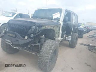 2014 Jeep Wrangler Unlimited Rubicon X with VIN 1C4HJWFG3EL274905, listed as a IAAI auction lot 41512631 with 123,961 mi miles and . Bid and sale history available at DreamBid. Image 18.
