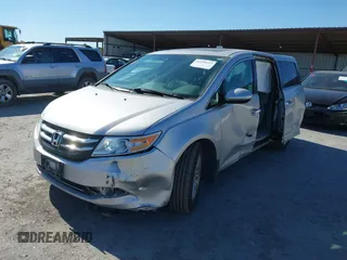 2014 Honda Odyssey EX-L with VIN 5FNRL5H63EB041106, listed as a IAAI auction lot 42294113 with 122,610 mi miles and . Bid and sale history available at DreamBid. Image 2.