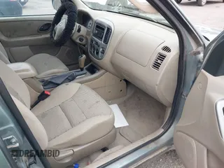 2005 Ford Escape XLT with VIN 1FMYU93165KA02357, listed as a IAAI auction lot 42858975 with 119,905 mi miles and . Bid and sale history available at DreamBid. Image 5.