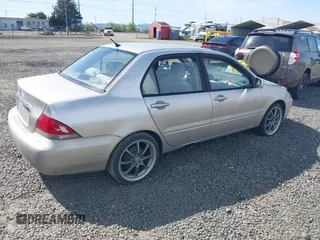2005 Mitsubishi Lancer ES with VIN JA3AJ26E55U014748, listed as a IAAI auction lot 41935566 with 255,336 mi miles. Bid and sale history available at carsss.com. Image 4.