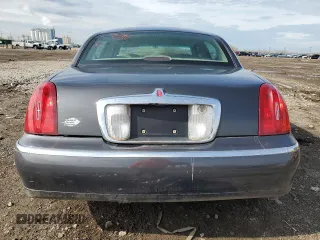 1999 Lincoln Town Car Executive z VIN 1LNHM81W0XY644873, wystawiony jako Copart lot #52865095 z przebiegiem Nie podano mil oraz Szkoda całkowita • Salvage title. Historia ofert i sprzedaży dostępna na DreamBid. Obrazek 6.