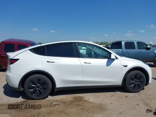 2024 Tesla Model Y with VIN 7SAYGDED0RA327806, listed as a IAAI auction lot 42096752 with 13,244 mi miles and . Bid and sale history available at DreamBid. Image 13.