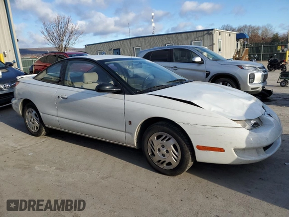 1999 Saturn SC z VIN 1G8ZR1275XZ375833, wystawiony jako Copart lot #87960885 z przebiegiem 97 697 mil mil oraz Szkody całkowita. Historia ofert i sprzedaży dostępna na DreamBid. Obrazek 4.