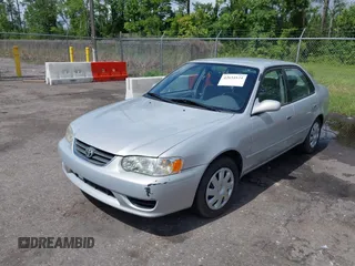 2002 Toyota Corolla CE with VIN 1NXBR12E12Z581660, listed as a IAAI auction lot 42654124 with 115,950 mi miles and . Bid and sale history available at DreamBid. Image 2.