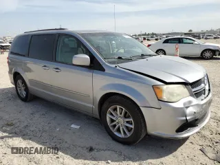 2014 Dodge Grand Caravan SXT with VIN 2C4RDGCG2ER273533, listed as a Copart auction lot 49228495 with 124,070 mi miles and Salvage Title. Bid and sale history available at DreamBid. Image 4.