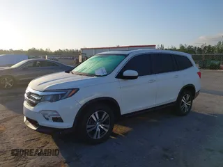 2017 Honda Pilot EX-L with VIN 5FNYF6H51HB037690, listed as a IAAI auction lot 41976359 with 126,055 mi miles and . Bid and sale history available at DreamBid. Image 18.
