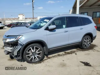 2022 Honda Pilot Elite z VIN 5FNYF6H06NB039385, wystawiony jako Copart lot #54979905 z przebiegiem Nie podano mil oraz Szkoda całkowita • Salvage title. Historia ofert i sprzedaży dostępna na DreamBid. Obrazek 1.