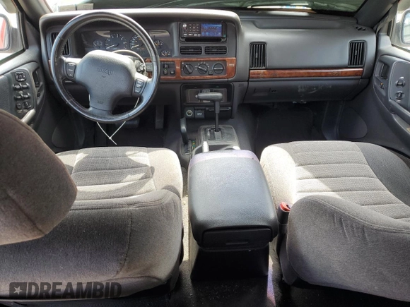 1997 Jeep Grand Cherokee Laredo with VIN 1J4GZ58S8VC601342, listed as a Copart auction lot 65360204 with 139,036 mi miles and Salvage Title. Bid and sale history available at carsss.com. Image 8.