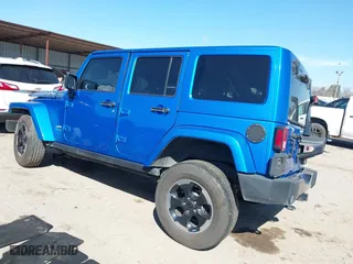 2014 Jeep Wrangler Unlimited Sahara with VIN 1C4HJWEG1EL188445, listed as a IAAI auction lot 41654579 with 79,948 mi miles. Bid and sale history available at carsss.com. Image 3.