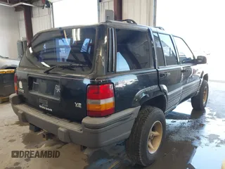 1995 Jeep Grand Cherokee Laredo z VIN 1J4GZ58Y3SC670696, wystawiony jako IAAI lot #42530934 z przebiegiem 165 658 mil mil oraz . Historia ofert i sprzedaży dostępna na DreamBid. Obrazek 4.
