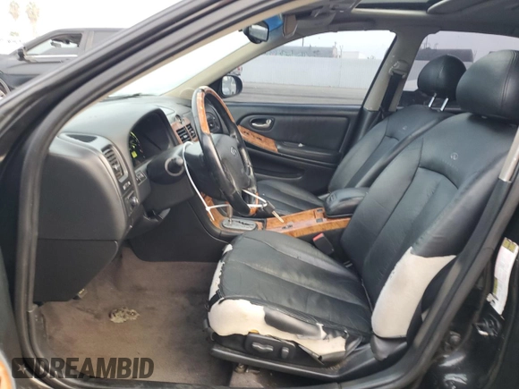2004 Infiniti I35 z VIN JNKDA31A54T212810, wystawiony jako Copart lot #72467654 z przebiegiem 137 809 mil mil oraz Szkoda całkowita • Salvage title. Historia ofert i sprzedaży dostępna na DreamBid. Obrazek 7.