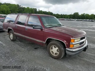 1999 Chevrolet Suburban with VIN 3GNEC16RXXG260623, listed as a Copart auction lot 54609694 with 246,460 mi miles and Salvage Title. Bid and sale history available at carsss.com. Image 4.