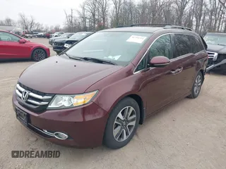 2014 Honda Odyssey Touring with VIN 5FNRL5H97EB117971, listed as a IAAI auction lot 41794324 with 198,191 mi miles and . Bid and sale history available at DreamBid. Image 2.