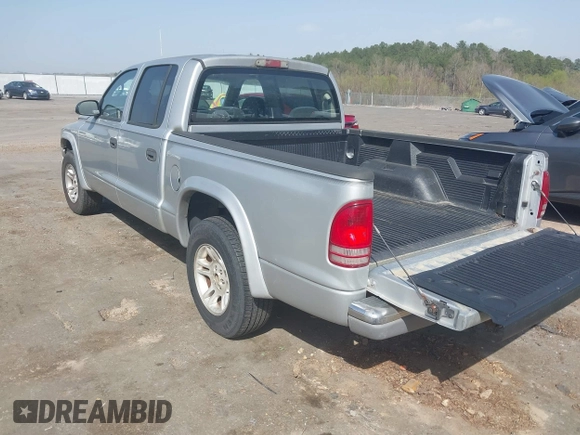 2003 Dodge Dakota SLT with VIN 1D7HL48N83S236590, listed as a IAAI auction lot 41796103 with 221,667 mi miles. Bid and sale history available at carsss.com. Image 3.