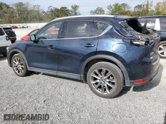 2021 Mazda CX-5 Signature with VIN JM3KFBEY3M0439658, listed as a Copart auction lot 74534464 with 50,816 mi miles and Salvage Title. Bid and sale history available at carsss.com. Image 2.