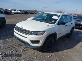 2018 Jeep Compass Sport with VIN 3C4NJCABXJT263332, listed as a IAAI auction lot 41554259 with 91,156 mi miles and . Bid and sale history available at DreamBid. Image 2.