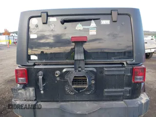 2014 Jeep Wrangler Sahara with VIN 1C4AJWBG5EL247812, listed as a IAAI auction lot 40909884 with 106,475 mi miles and . Bid and sale history available at DreamBid. Image 16.