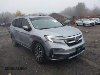 2019 Honda Pilot Touring 7-Passenger with VIN 5FNYF6H67KB018030, listed as a IAAI auction lot 40724349 with 94,657 mi miles. Bid and sale history available at carsss.com. Image 1.