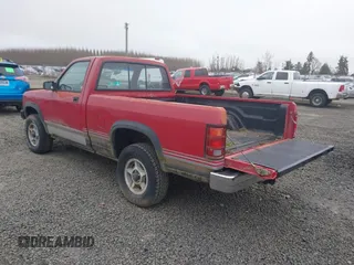 1989 Dodge Dakota z VIN 1B7GG66X9KS094016, wystawiony jako IAAI lot #41734985 z przebiegiem 156 980 mil mil oraz . Historia ofert i sprzedaży dostępna na DreamBid. Obrazek 3.