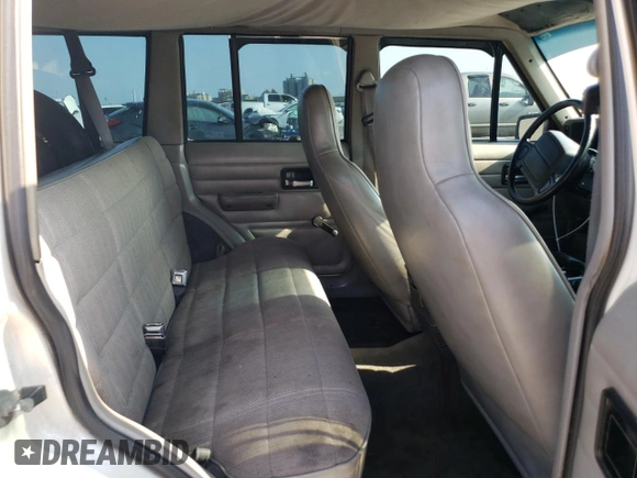 1996 Jeep Cherokee SE with VIN 1J4FT28S3TL197827, listed as a Copart auction lot 75443574 with 116,660 mi miles and Salvage Title. Bid and sale history available at carsss.com. Image 11.