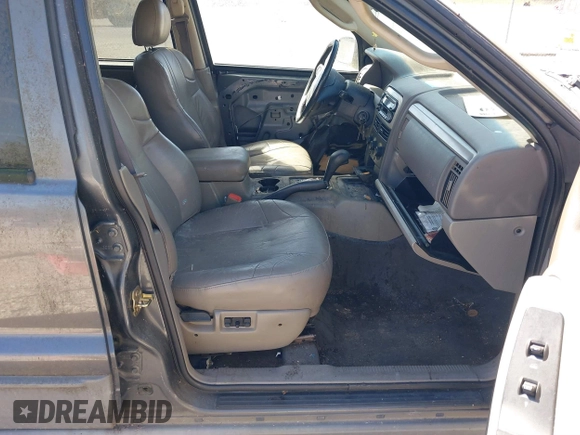2002 Jeep Grand Cherokee z VIN 1J4GX38S92C149908, wystawiony jako IAAI lot #41782530 z przebiegiem 145 195 mil mil oraz . Historia ofert i sprzedaży dostępna na DreamBid. Obrazek 5.