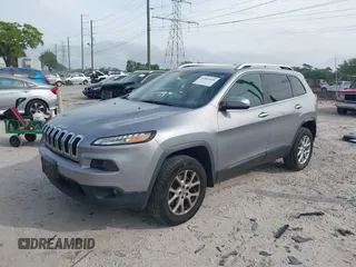 2014 Jeep Cherokee Altitude with VIN 1C4PJMCB4EW107556, listed as a IAAI auction lot 41881448 with 212,816 mi miles and . Bid and sale history available at carsss.com. Image 2.