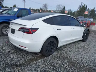 2023 Tesla Model 3 with VIN 5YJ3E1EA2PF612427, listed as a IAAI auction lot 41793756 with 17,913 mi miles and . Bid and sale history available at carsss.com. Image 4.