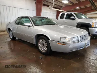 1999 Cadillac Eldorado z VIN 1G6EL12Y1XU611974, wystawiony jako Copart lot #71761494 z przebiegiem 139 494 mil mil oraz Czysty tytuł • Clean title. Historia ofert i sprzedaży dostępna na DreamBid. Obrazek 4.